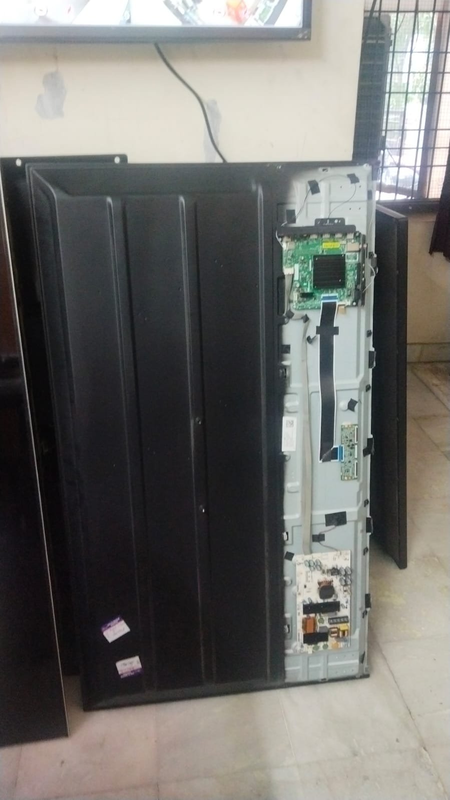 TV Has No Picture — television being checked by a repair technician