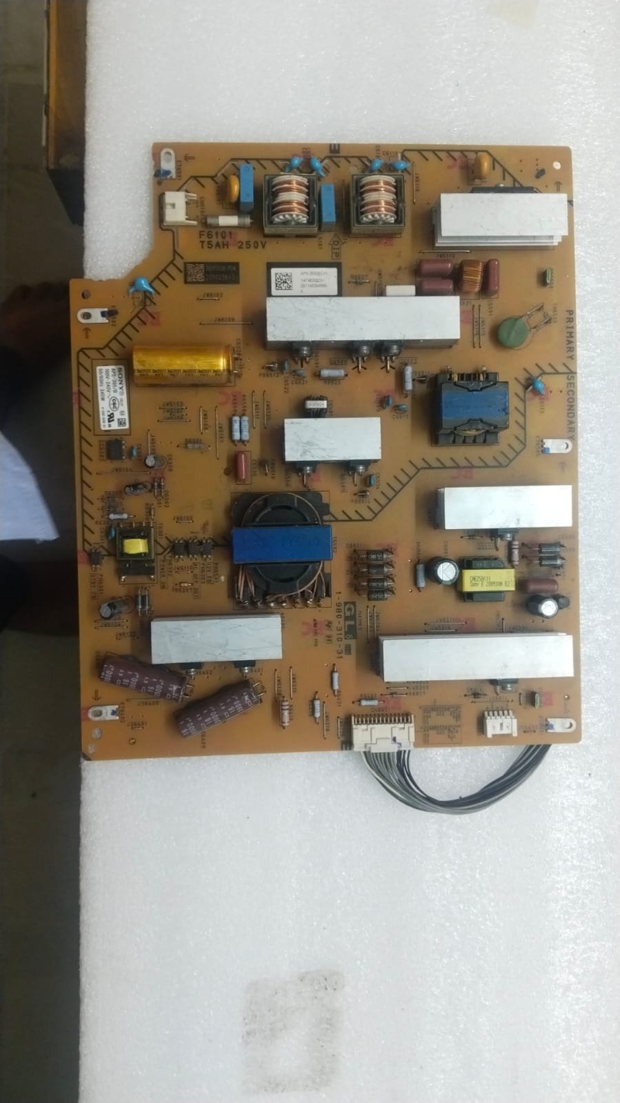 TV Power Board Issues — television being checked by a repair technician